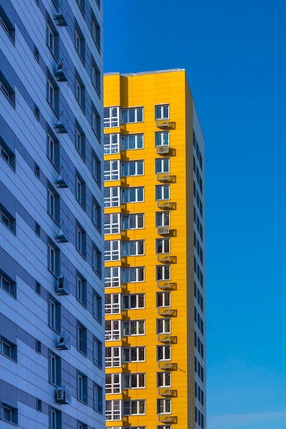 New yellow high-rise multi-storey residential building