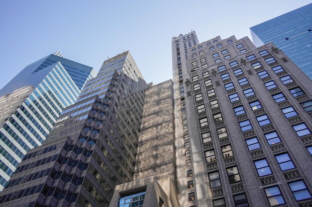 New york manhattan skyscrapers view from the street to the top of the building on sunny clear day