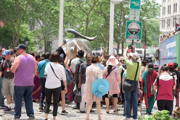 NEW YORK - USA - 11 JUNE 2015 wall street bull finance symbol is crowded of people