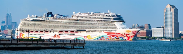 New York USA June 13 2023 Cruise ship Norwegian Joy Sailing next to Manhattan in New York Skyline of New York Manhattan cruising on the Hudson River cruise liner NCL