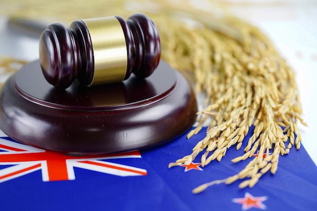 New Zealand flag and Judge hammer with gold grain from agriculture farm