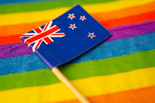 New Zealand flag on rainbow symbol of LGBT gay pride month.