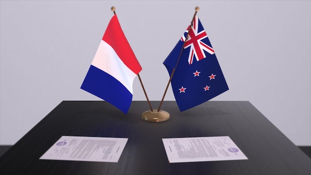 New Zealand and France national flags on table in diplomatic conference room Politics deal agreement