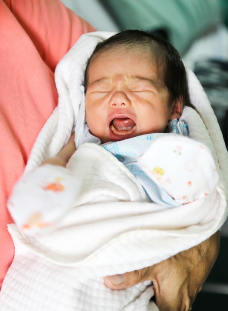 Newborn Asian baby girl crying 