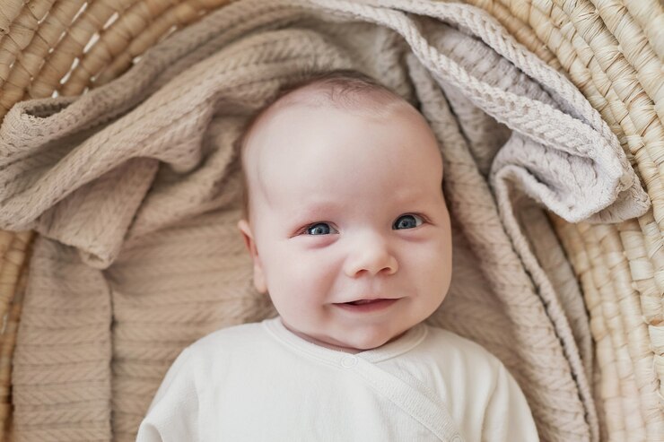Newborn baby boy lies in wicker cradle. Medicine and health concept, happy motherhood and fatherhood. Maternity hospital and clinic. Father and mother day.