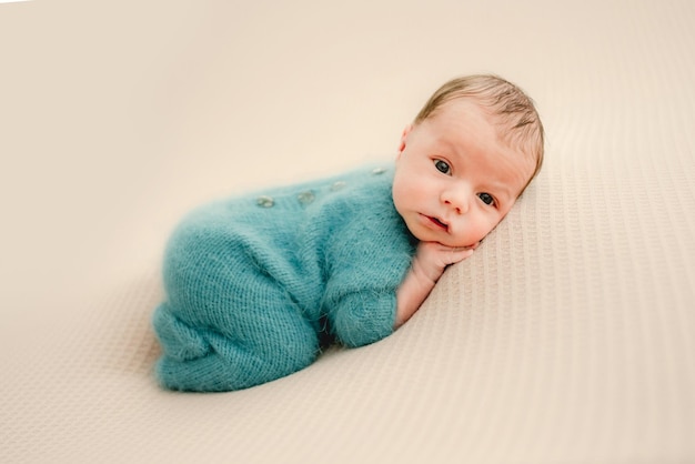 Newborn baby boy studio portrait