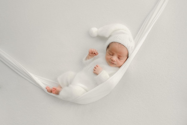 Newborn baby boy waiting for being dressed after birth Stock Photo