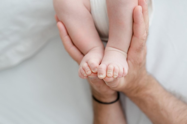 Newborn baby feet on white background newborn photo idea. Natural and simple lifestyle photo idea