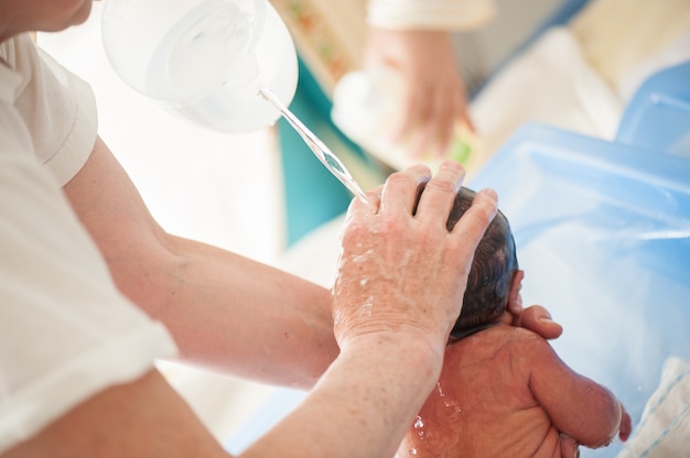 Newborn baby first bath