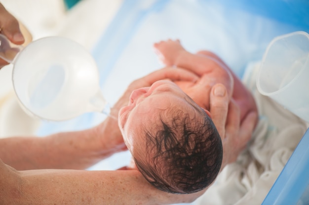 Newborn baby first bath