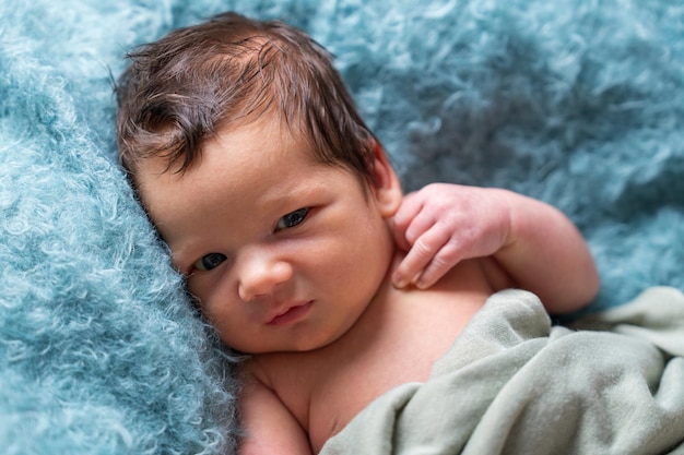 Newborn baby in the first days of life Cute little newborn baby