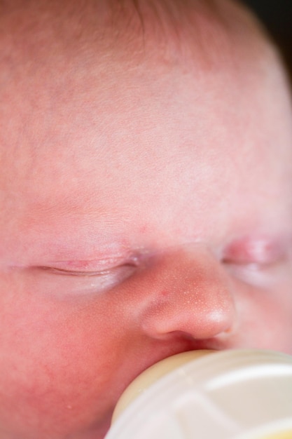 Newborn baby girl at feeding time.