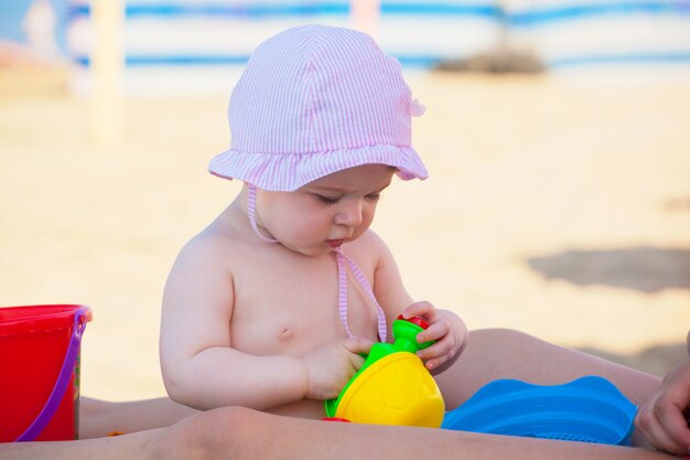 Newborn baby girl at the sea