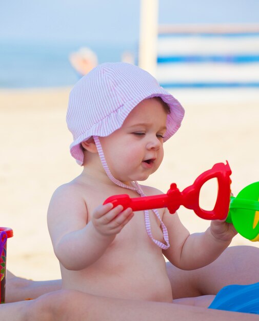 Newborn baby girl at the sea