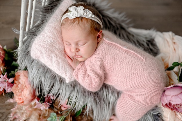 Newborn baby girl studio portrait