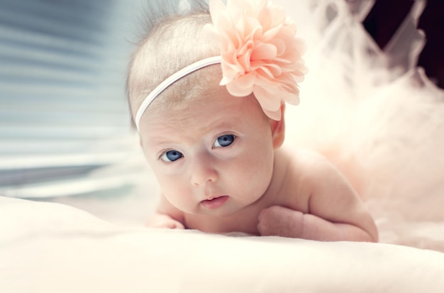 Newborn baby girl with a piercing look