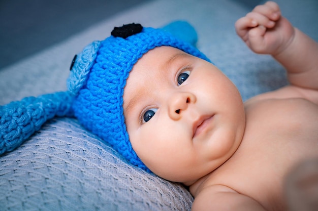 Newborn baby in a hat Little boy in a blue suit