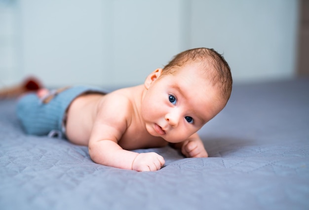 Newborn baby in a hat Little boy in a blue suit