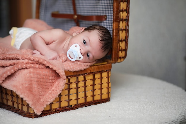 Newborn baby lying on the blanket and sleeping