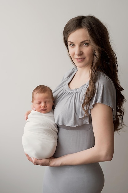 Newborn baby in mother's arms Postcard Mother's Day Children Protection Day World Happiness Day Smiling child and woman