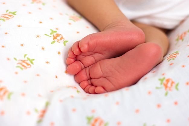 Newborn baby's foot. Pink toes of a baby