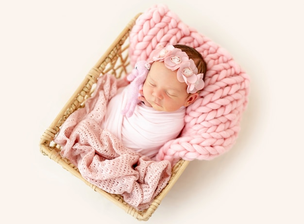 Newborn baby sleeping in the basket