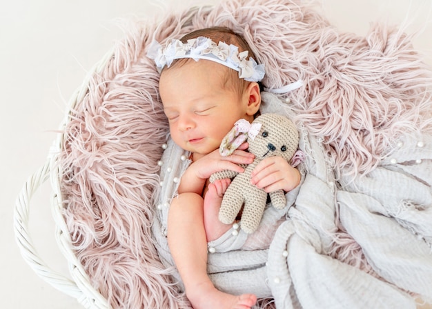 Newborn baby sleeping in the basket