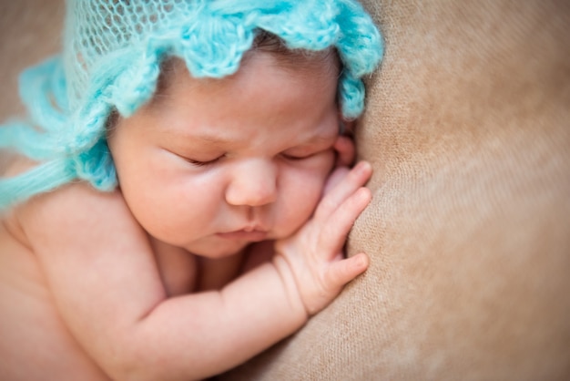 Newborn baby sleeping on a blanket