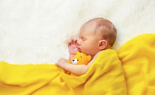Newborn baby sleeping on a white background. Selective focus. people.