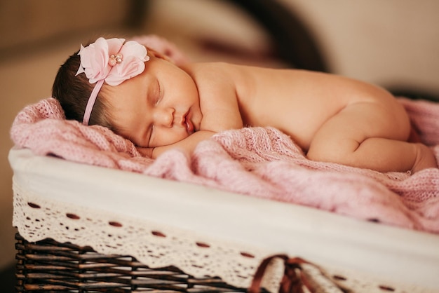 Newborn baby sleeps in basket