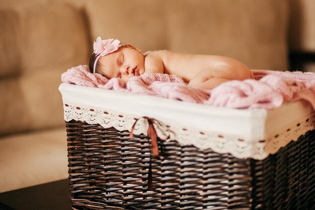 Newborn baby sleeps in basket