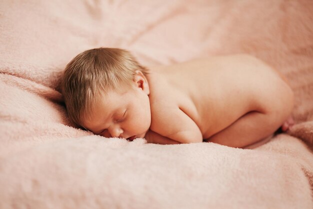 Newborn baby sleeps in basket