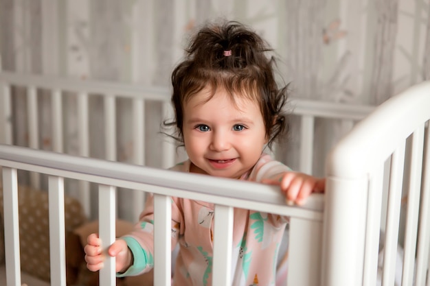 newborn baby toddler girl in baby bed