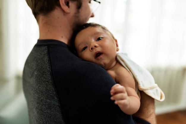 A newborn baby with family