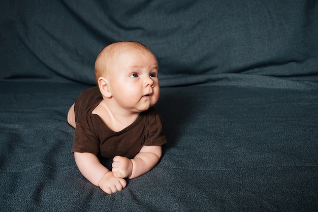 Newborn boy lying on a blanket