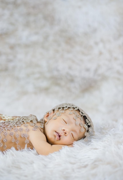 Newborn Cute Baby Infant on wool shag rug background