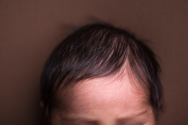 Newborn forehead head body part brain top of