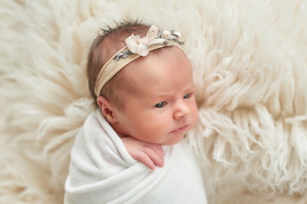 newborn girl on a light background