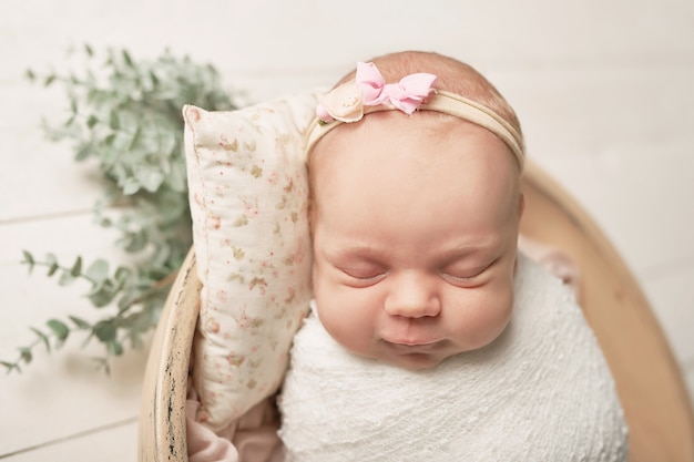 newborn girl on a white 