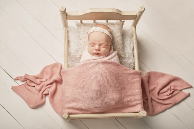 newborn girl on a white 