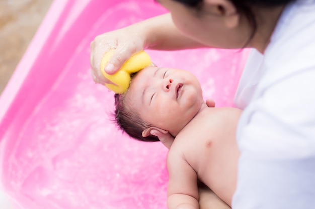 newborn having a bath