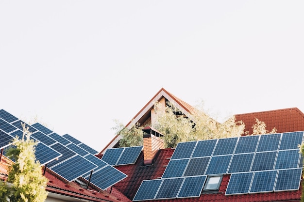 Newly build houses with solar panels attached on the roof against a sunny skysolar panels