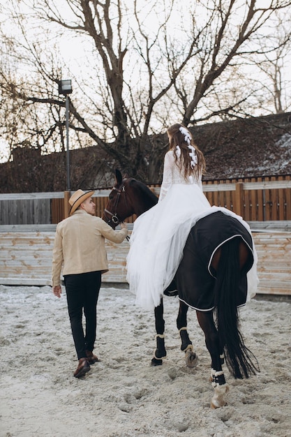 Newly married couple on ranch in winter season