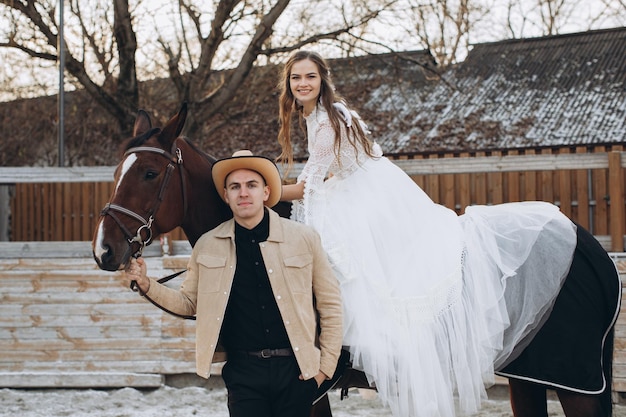 Newly married couple on ranch in winter season