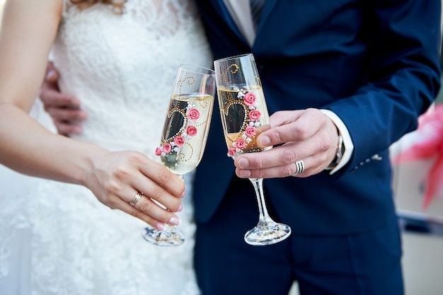 newly married couple toasting