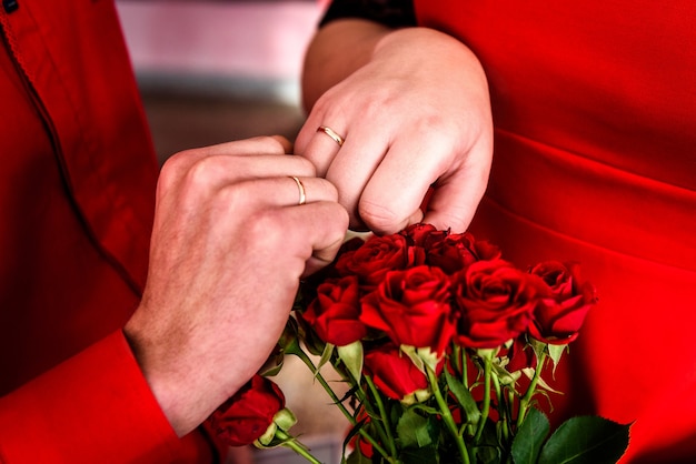 Newly wed couple's hands with wedding rings