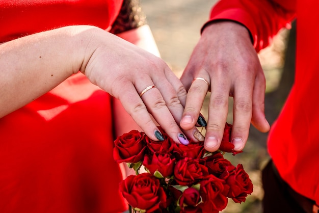 Newly wed couple's hands with wedding rings