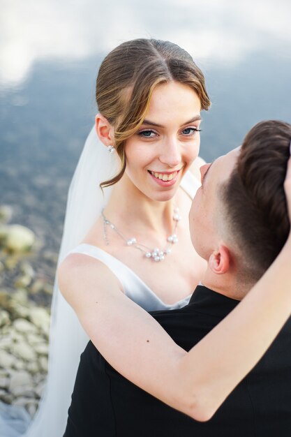 Newlywed kissing and hugs Wedding day