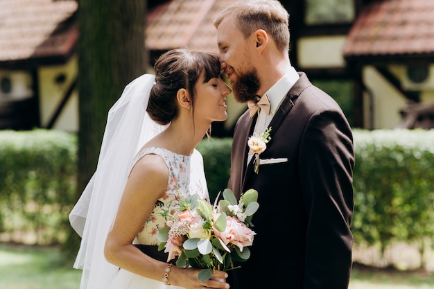 Newlyweds are smiling at each other