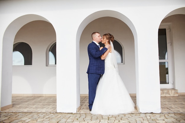 newlyweds embrace and kiss